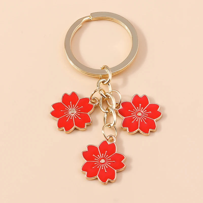 Llavero de Flor de Sakura en Esmalte Lila: Elegancia Japonesa