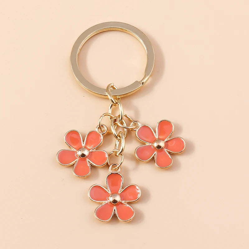 Llavero de Flor de Sakura en Esmalte Lila: Elegancia Japonesa